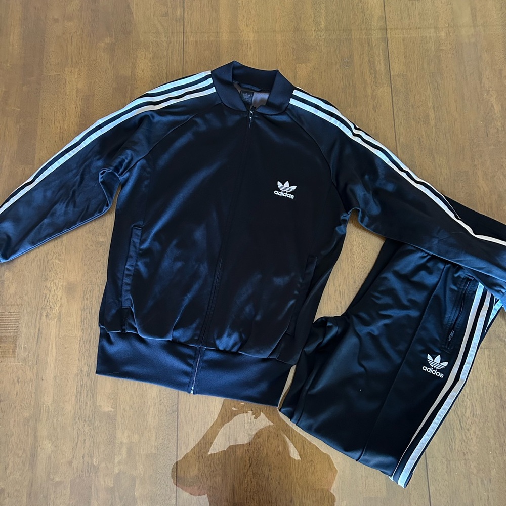 Adidas Black Tracksuit with Blue Stripes top is a small